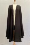 Black abaya cape with arm slits, some pulls to fabric and usage