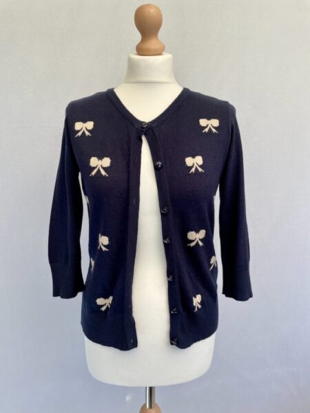 Dorothy Perkins navy knit cardigan with beige bow patterns, size 10