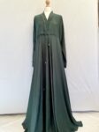 emerald green zadina abaya with wide sleeves, flared skirt, sequins around the neck