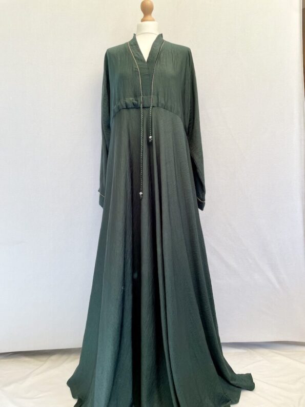 emerald green zadina abaya with wide sleeves, flared skirt, sequins around the neck