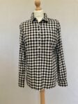 Purchase this Tommy Hilfiger black and white chequered blouse in size M with a collar, button cuff and buttons on the front.