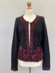 Monsoon black knit cardigan with cross stitch embroidery in shades of pink and purple. Open front.Size 16